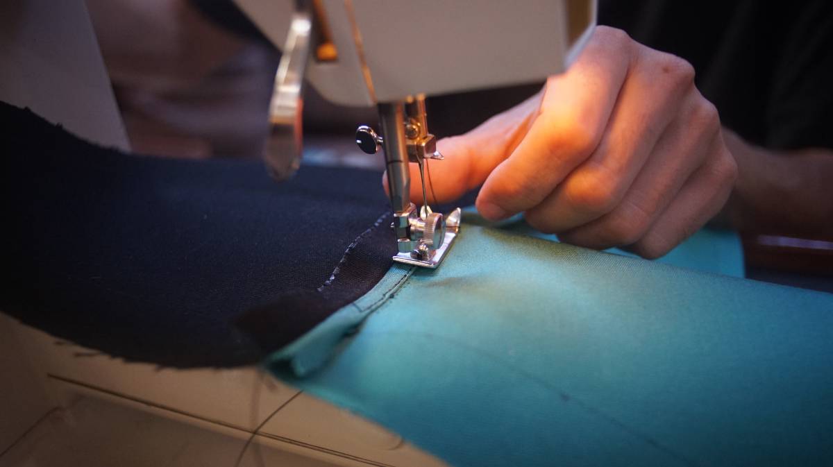 devine sewing the burgee using a sewing machine