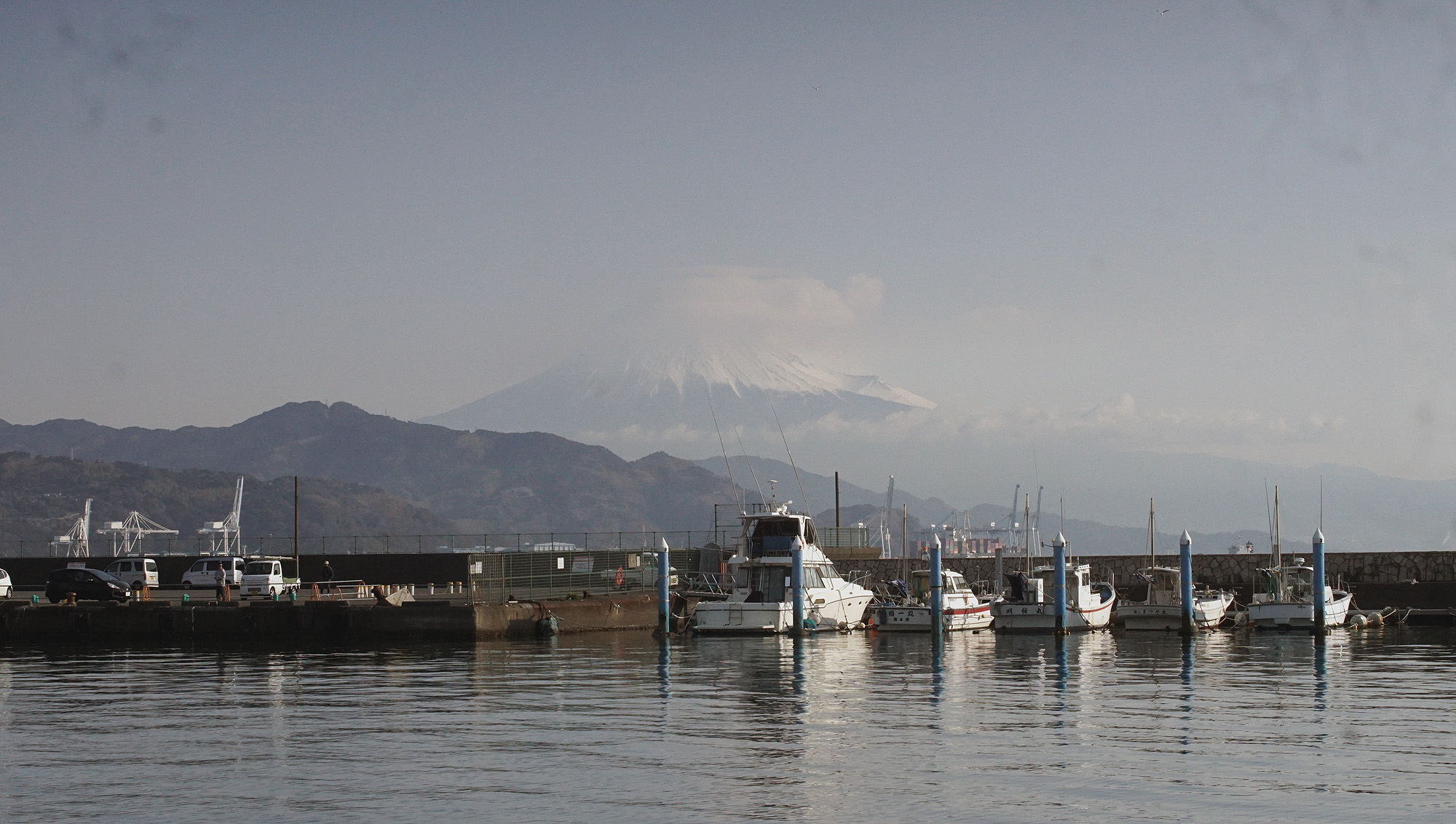 a look at mount fuji from our mooring spot, a marina is visible