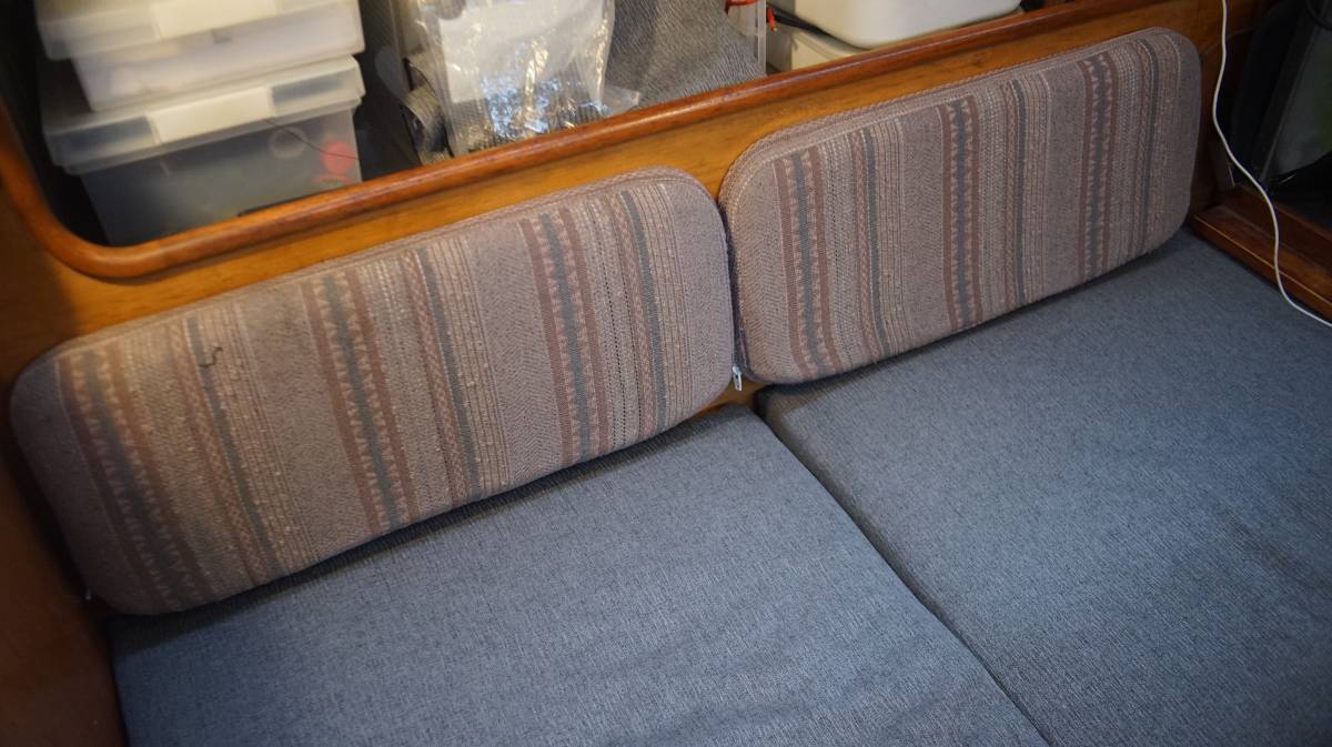 saloon backrests covered in old fabric next to new cushions
