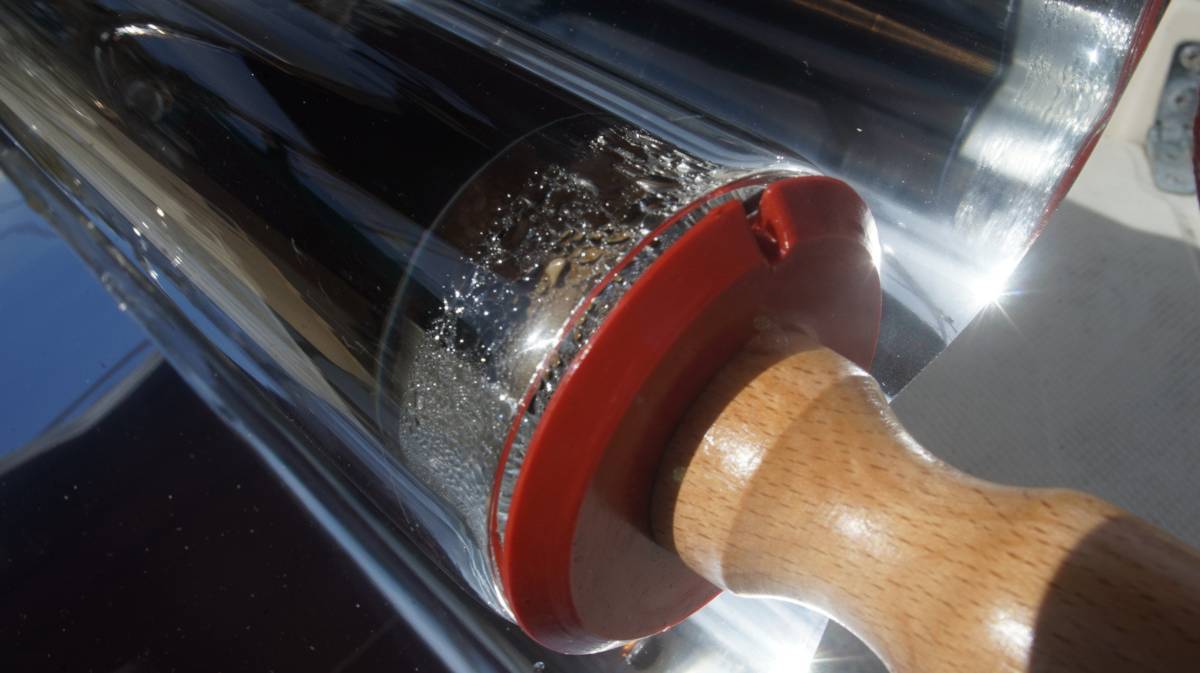 a cooking solar evacuated tube, with steam escaping from a little vent