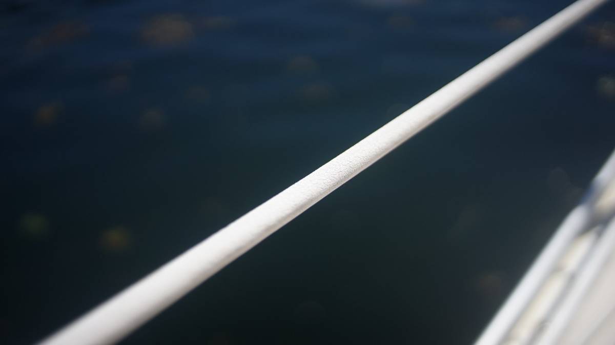 lifelines on a sailboat covered with a plastic covering