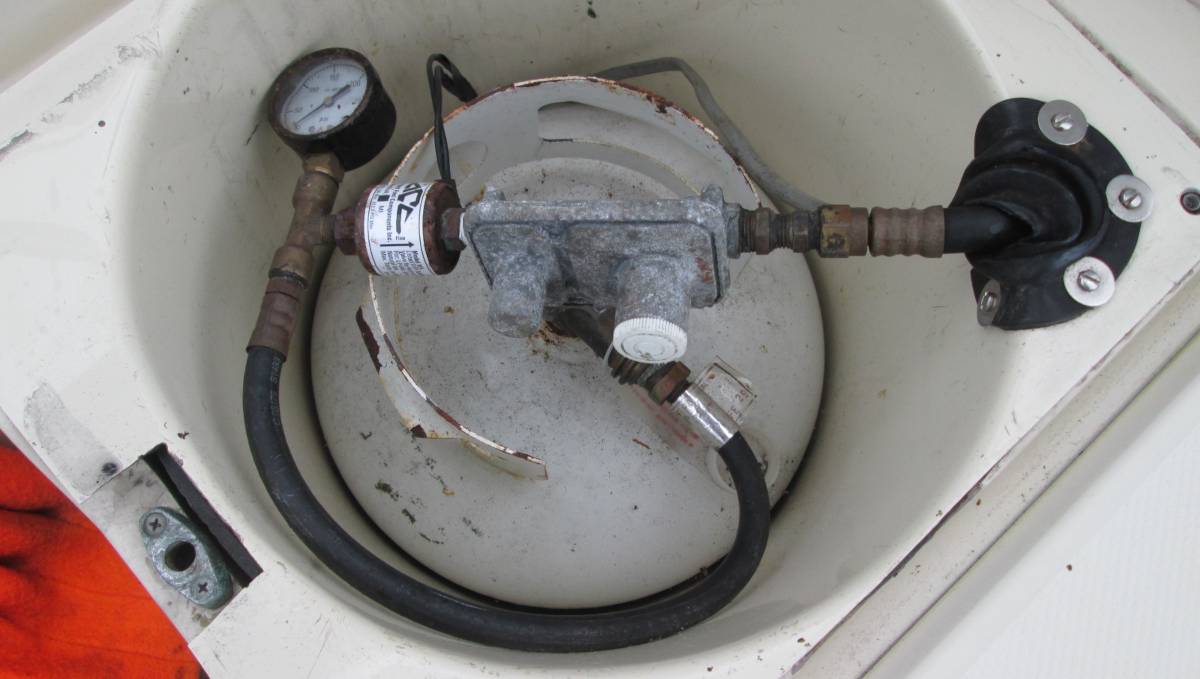 propane locker with components in a just okay condition