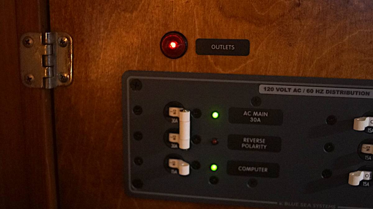 a breaker panel with a red light on