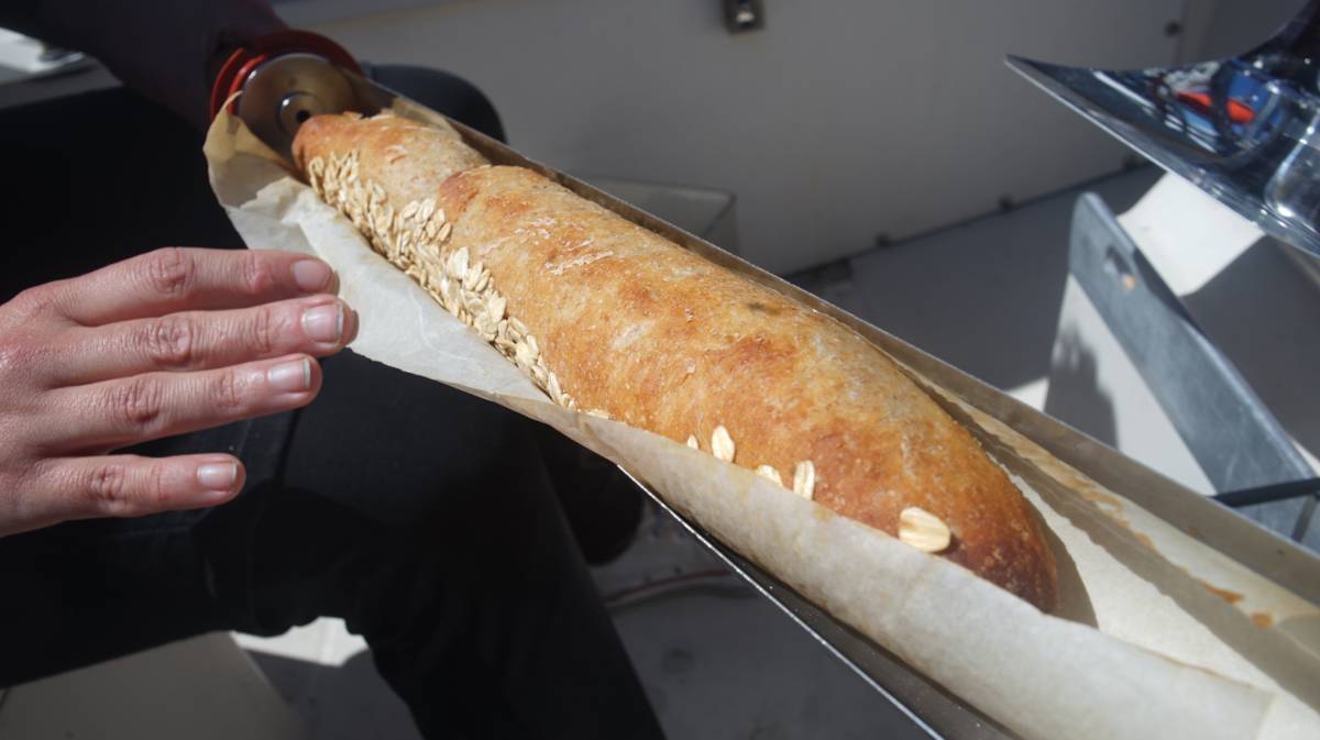 a cooked and browned baguette sitting in a solar evacuated tube tray