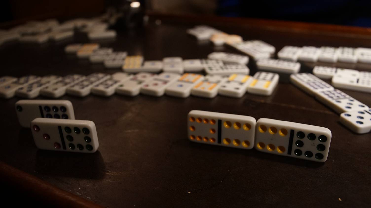a game of mexican train played with double twelve dominoes