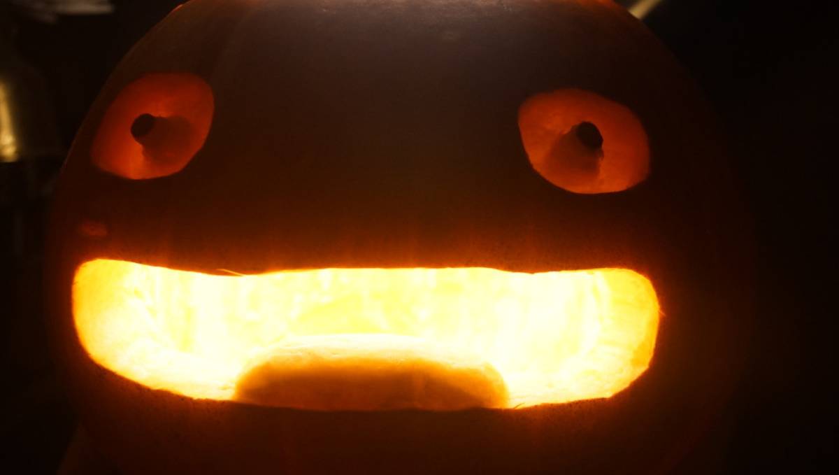 A photo of calcifers face carved onto a pumpkin