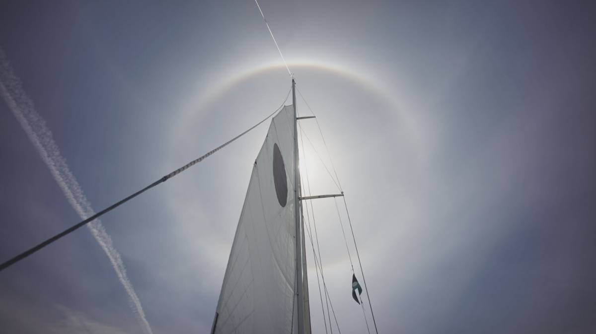 a halo around the sun viewed from the deck of our sailboat Pino