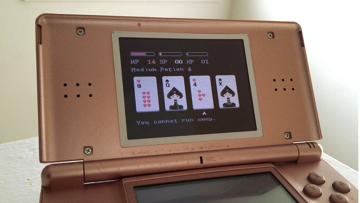 A photo of a pink Nintendo DS with the card game Donsol on the screen