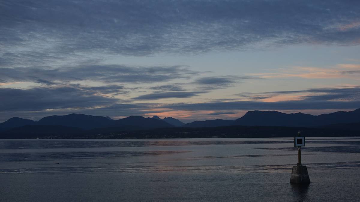 a beautiful evening on texada, with a view of a quiet ocean, and shadowed mountains